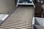 Inspection-roller-table-PRS-with-waste-tubes-on-the-side.jpg